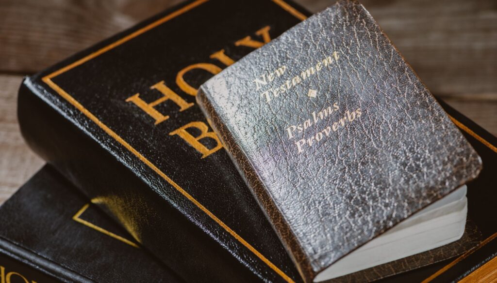 bibles with psalms and proverbs stacked