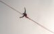 man walking on a tightrope